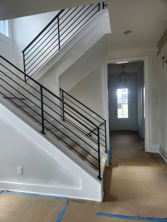 1052 Wetzel Dr, Franklin, TN 37064 - stairs with a chandelier