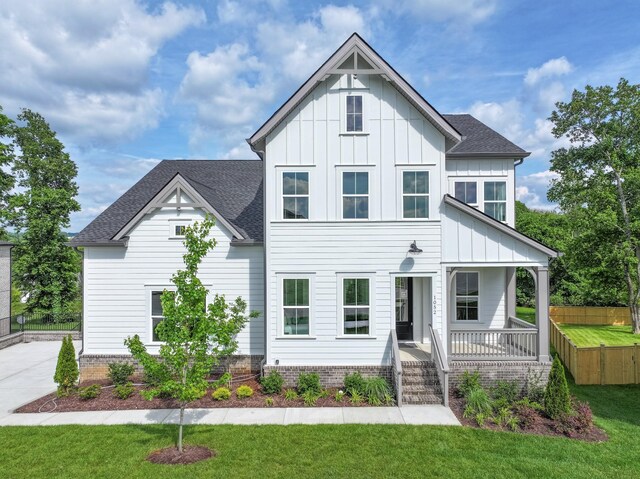 1052 Wetzel Dr, Franklin, TN 37064 - view of front of property featuring a porch, board and batten siding, and roof with shingles