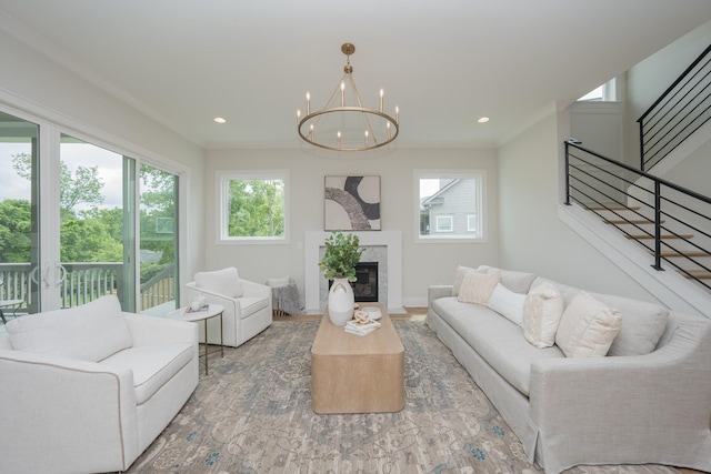 1052 Wetzel Dr, Franklin, TN 37064 - living area with plenty of natural light, stairs, a chandelier, a high end fireplace, and recessed lighting