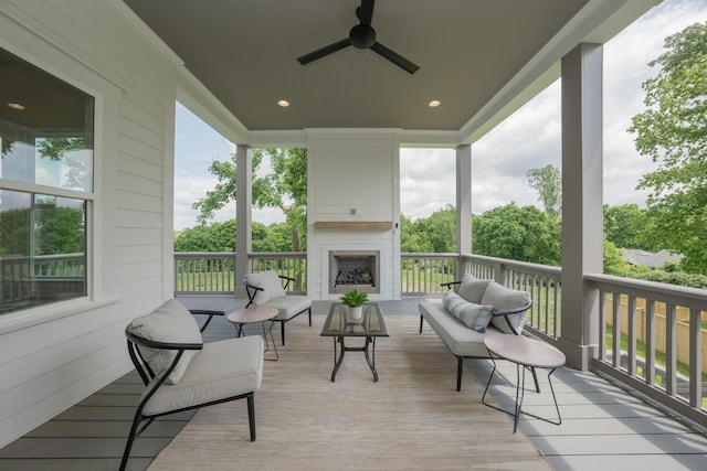 1052 Wetzel Dr, Franklin, TN 37064 - wooden terrace with ceiling fan and an outdoor living space with a fireplace