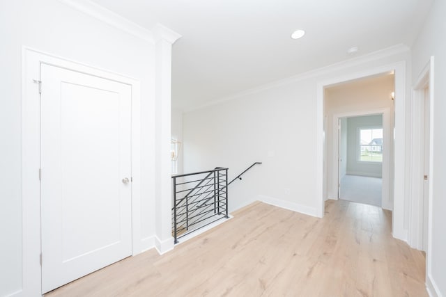 1052 Wetzel Dr, Franklin, TN 37064 - corridor with an upstairs landing, light wood-style flooring, crown molding, baseboards, and recessed lighting