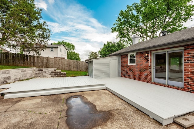 view of patio featuring a fenced backyard and a deck