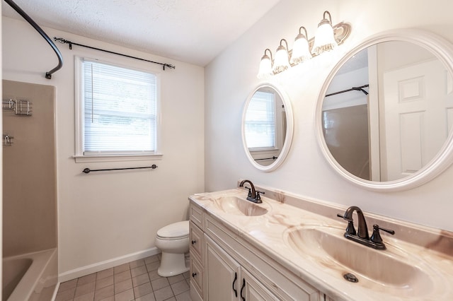 full bathroom with a sink, tile patterned floors, and a wealth of natural light