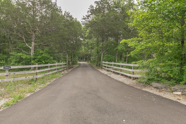 view of street with a wooded view