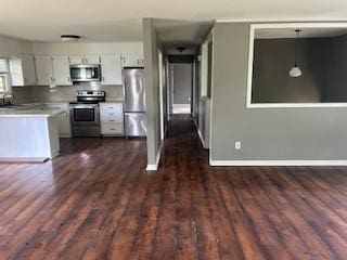 1708 Deer Hollow Dr, Lawrenceburg, TN 38464 - kitchen with stainless steel appliances, light countertops, dark wood finished floors, and baseboards