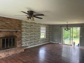 1708 Deer Hollow Dr, Lawrenceburg, TN 38464 - unfurnished living room featuring baseboards, a brick fireplace, and healthy amount of natural light