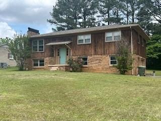 1708 Deer Hollow Dr, Lawrenceburg, TN 38464 - raised ranch featuring a chimney and a front lawn
