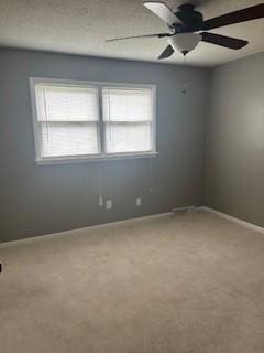 1708 Deer Hollow Dr, Lawrenceburg, TN 38464 - empty room featuring carpet flooring, baseboards, and ceiling fan