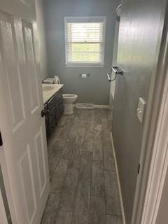 1708 Deer Hollow Dr, Lawrenceburg, TN 38464 - bathroom featuring vanity, wood finished floors, and toilet
