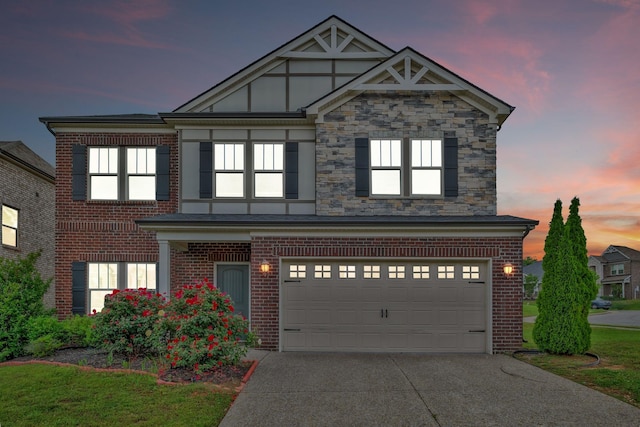 4284 Stone Hall Blvd, Hermitage, TN 37076 - view of front of home featuring concrete driveway, brick siding, and an attached garage