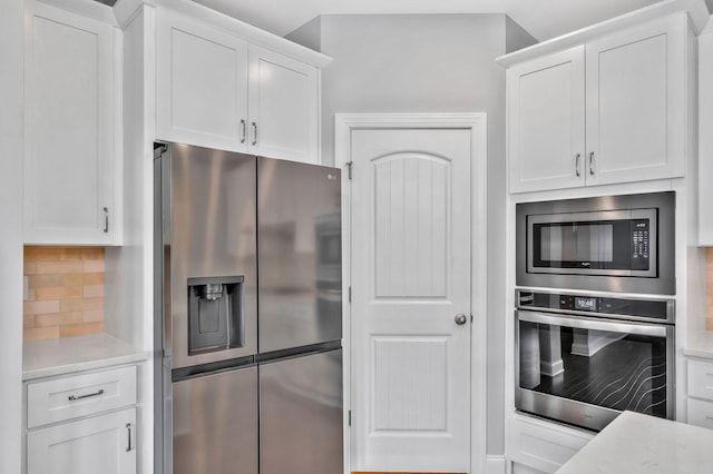 4284 Stone Hall Blvd, Hermitage, TN 37076 - kitchen with backsplash, stainless steel appliances, and white cabinetry