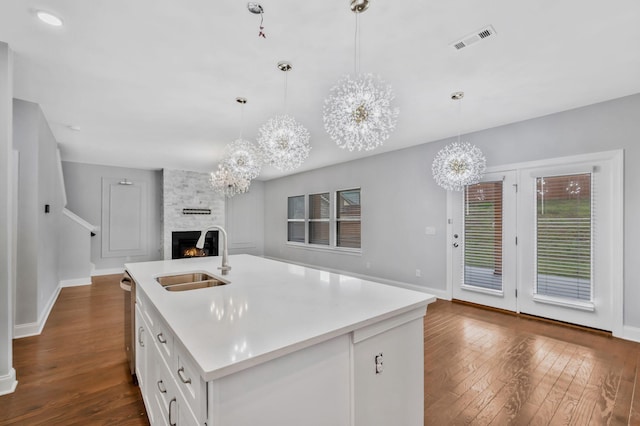 4284 Stone Hall Blvd, Hermitage, TN 37076 - kitchen with a stone fireplace, visible vents, a sink, a chandelier, and open floor plan
