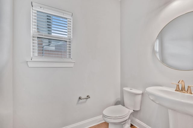 4284 Stone Hall Blvd, Hermitage, TN 37076 - bathroom featuring toilet, baseboards, a sink, and wood finished floors