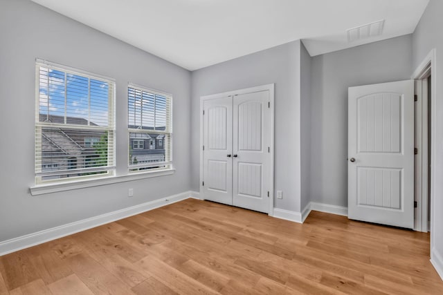 4284 Stone Hall Blvd, Hermitage, TN 37076 - unfurnished bedroom with light wood-style floors, baseboards, a closet, and visible vents