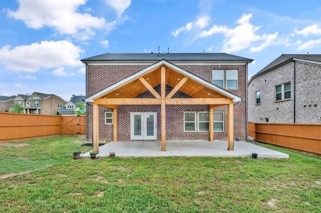 4284 Stone Hall Blvd, Hermitage, TN 37076 - back of property featuring a fenced backyard, a yard, a patio area, and brick siding