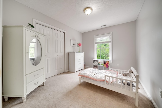 116 N Wynridge Way, Goodlettsville, TN 37072 - bedroom featuring light carpet, a textured ceiling, a closet, and baseboards