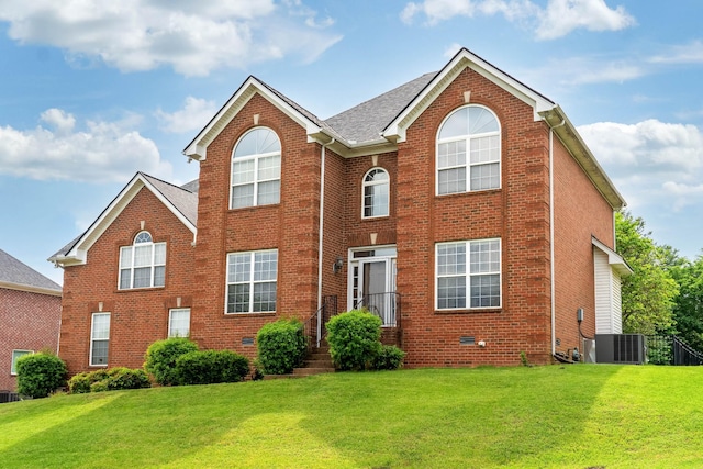 116 N Wynridge Way, Goodlettsville, TN 37072 - view of front facade with brick siding, a front yard, and central air condition unit