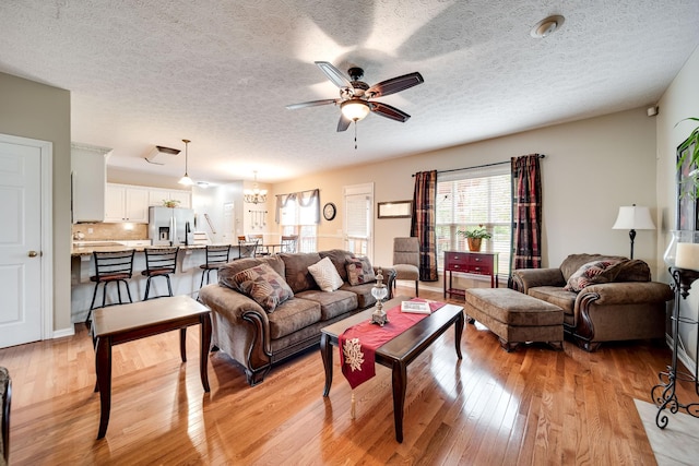 116 N Wynridge Way, Goodlettsville, TN 37072 - living room with light wood-type flooring, ceiling fan, a textured ceiling, and a chandelier