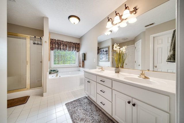 116 N Wynridge Way, Goodlettsville, TN 37072 - full bath featuring a bath, tile patterned flooring, a shower stall, double vanity, and a textured ceiling