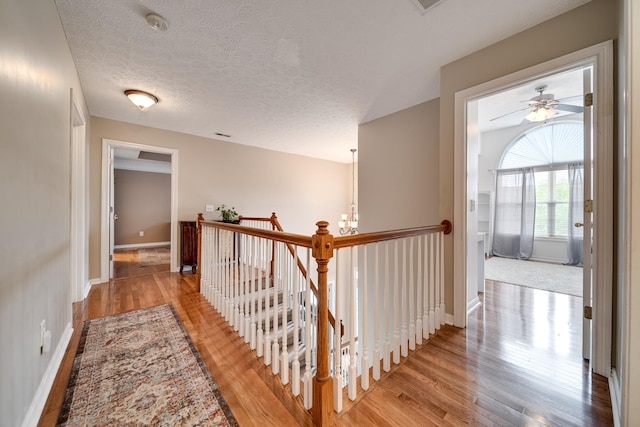 116 N Wynridge Way, Goodlettsville, TN 37072 - hallway with an upstairs landing, light wood finished floors, baseboards, and a textured ceiling