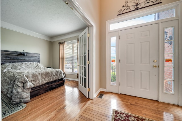 116 N Wynridge Way, Goodlettsville, TN 37072 - entrance foyer with ornamental molding, hardwood / wood-style floors, a textured ceiling, and baseboards