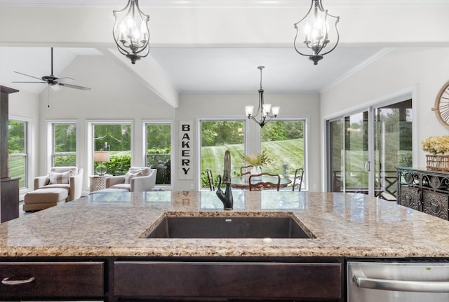 kitchen featuring stainless steel dishwasher, dark brown cabinetry, light stone countertops, open floor plan, and a sink