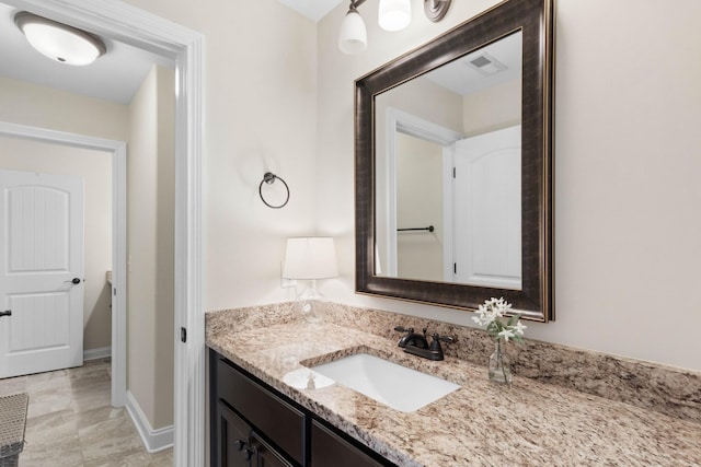 bathroom featuring vanity and visible vents