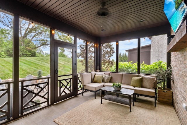 sunroom featuring an outdoor living space