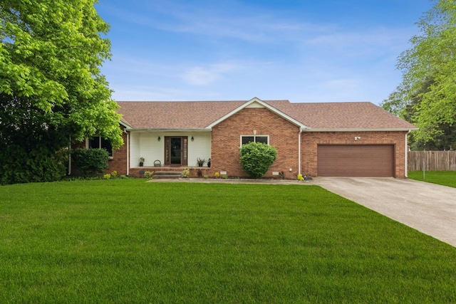 single story home featuring concrete driveway, brick siding, an attached garage, and a front lawn