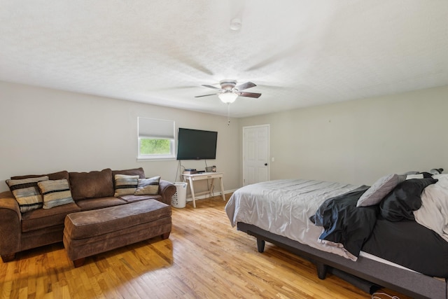 bedroom with a ceiling fan and light wood finished floors