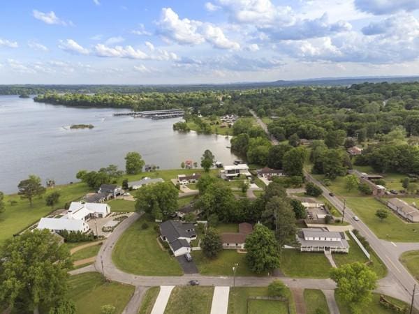 bird's eye view featuring a view of trees and a water view