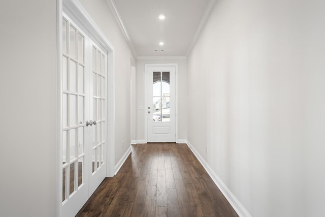 doorway featuring baseboards, ornamental molding, dark wood finished floors, and recessed lighting