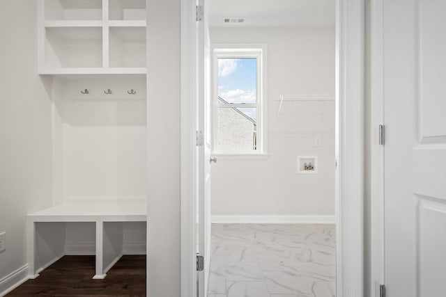 mudroom with marble finish floor and visible vents