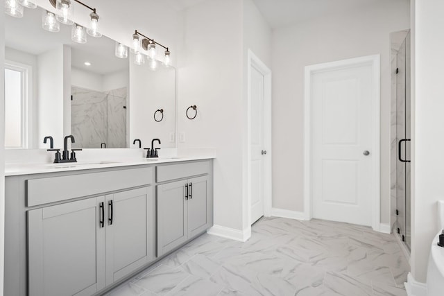 full bathroom featuring double vanity, a sink, marble finish floor, and a marble finish shower