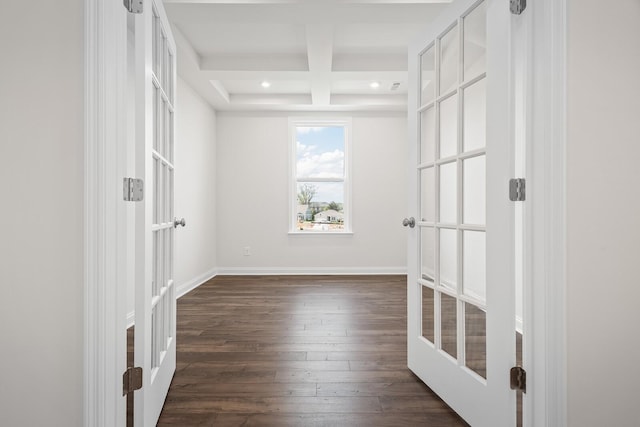 unfurnished room featuring beam ceiling, baseboards, dark wood-style floors, recessed lighting, and coffered ceiling