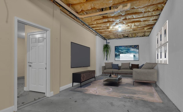 living room with unfinished concrete flooring