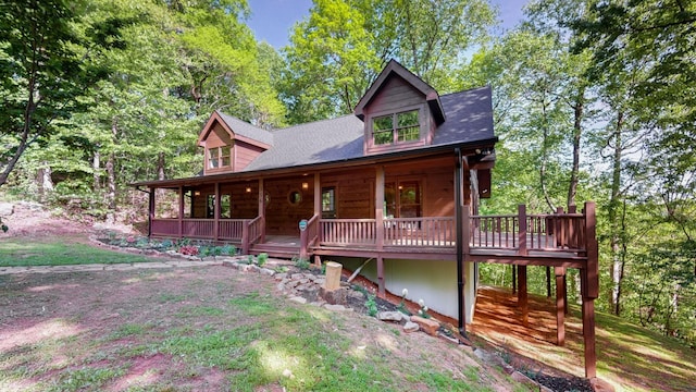 view of front of property featuring roof with shingles