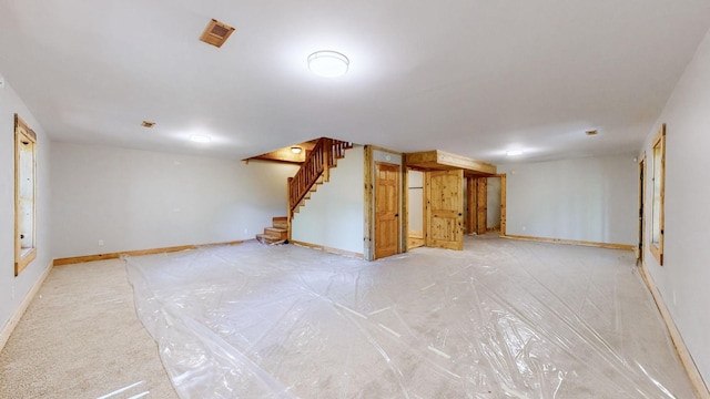 finished below grade area with baseboards and stairs