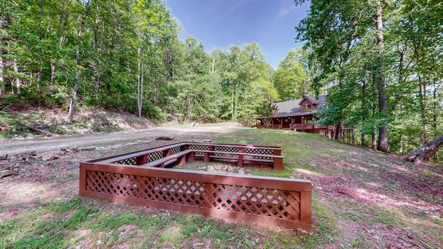 wooden deck with a view of trees
