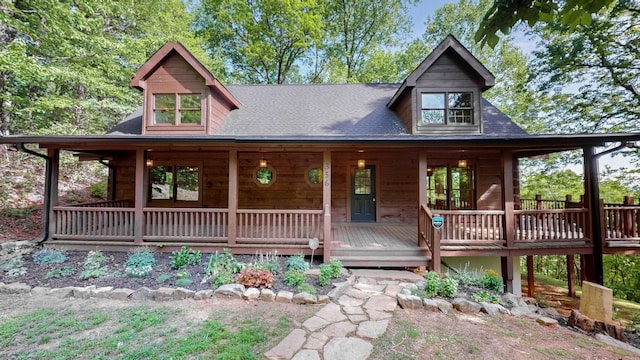 log-style house with a porch