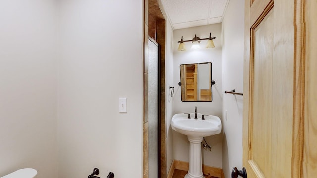 bathroom with an enclosed shower and toilet