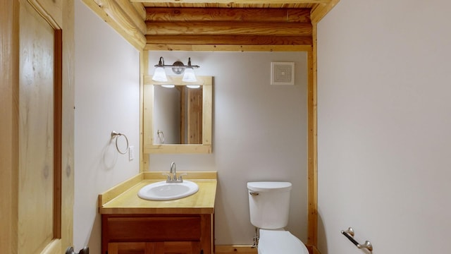 half bath with vanity and toilet