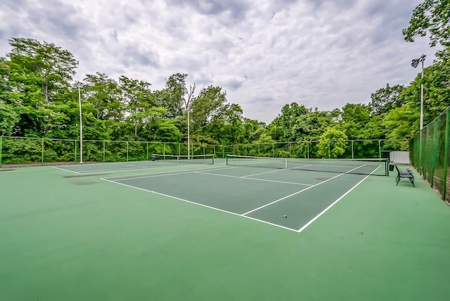 view of sport court featuring fence and community basketball court