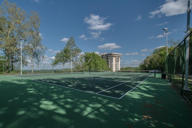 view of sport court with fence