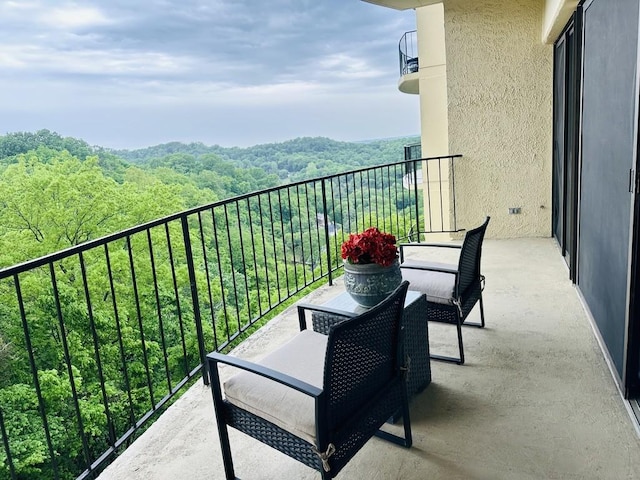 balcony with a forest view
