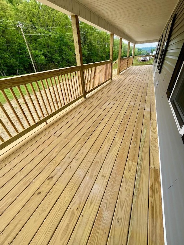 wooden terrace featuring a porch
