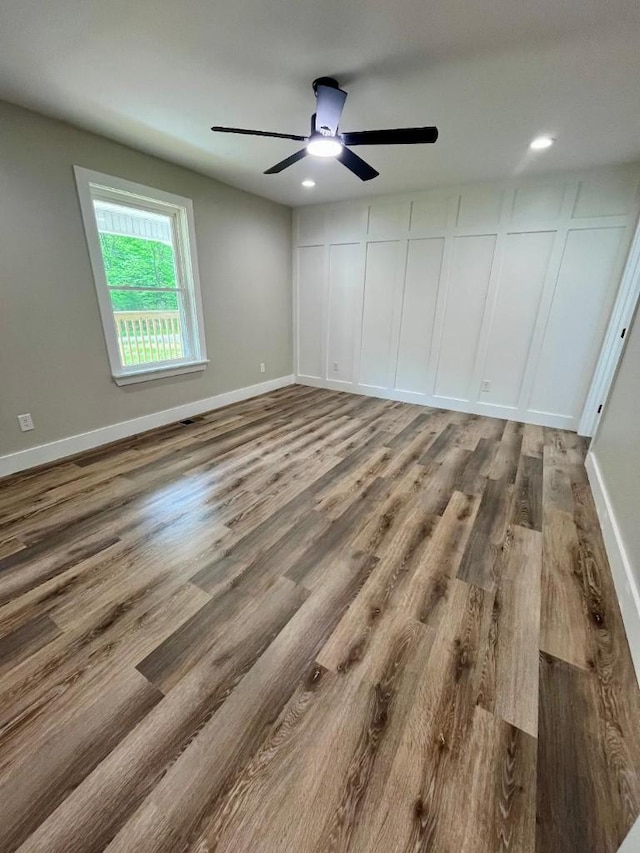unfurnished bedroom with baseboards, recessed lighting, ceiling fan, and wood finished floors