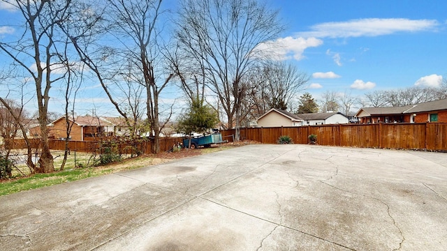 view of patio / terrace with fence and a residential view