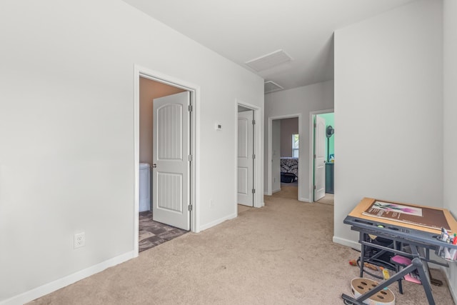 office area with baseboards, carpet, and visible vents
