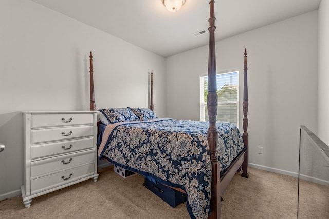 carpeted bedroom featuring baseboards and visible vents